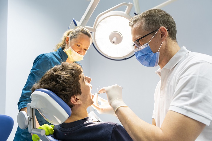 dentist and assistant performing operation